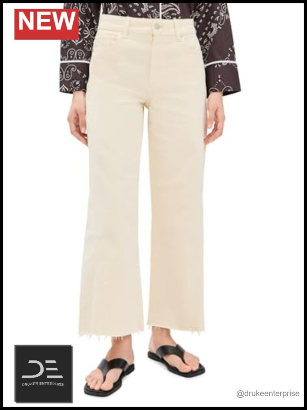 High Rise Wide Leg Jeans with Twisted Outseam and Raw Hem Cotton Blend